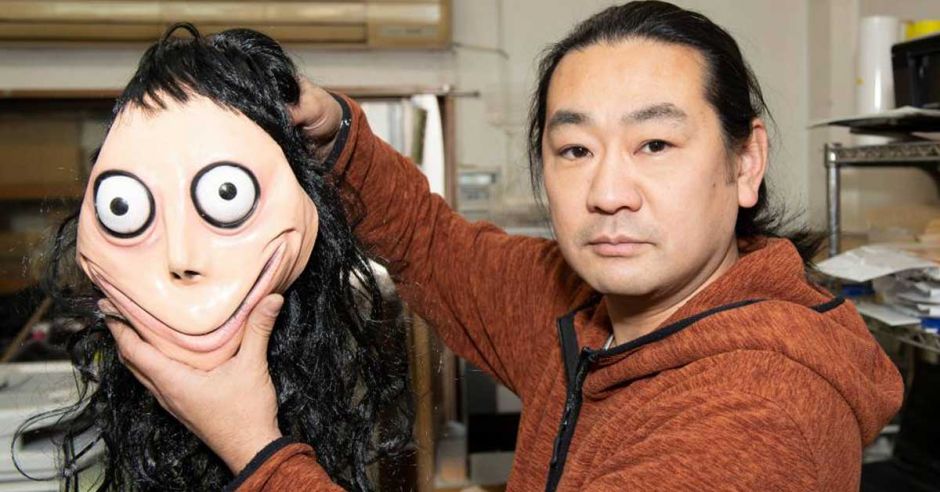Artist Keisuke Aiso with Momo mask